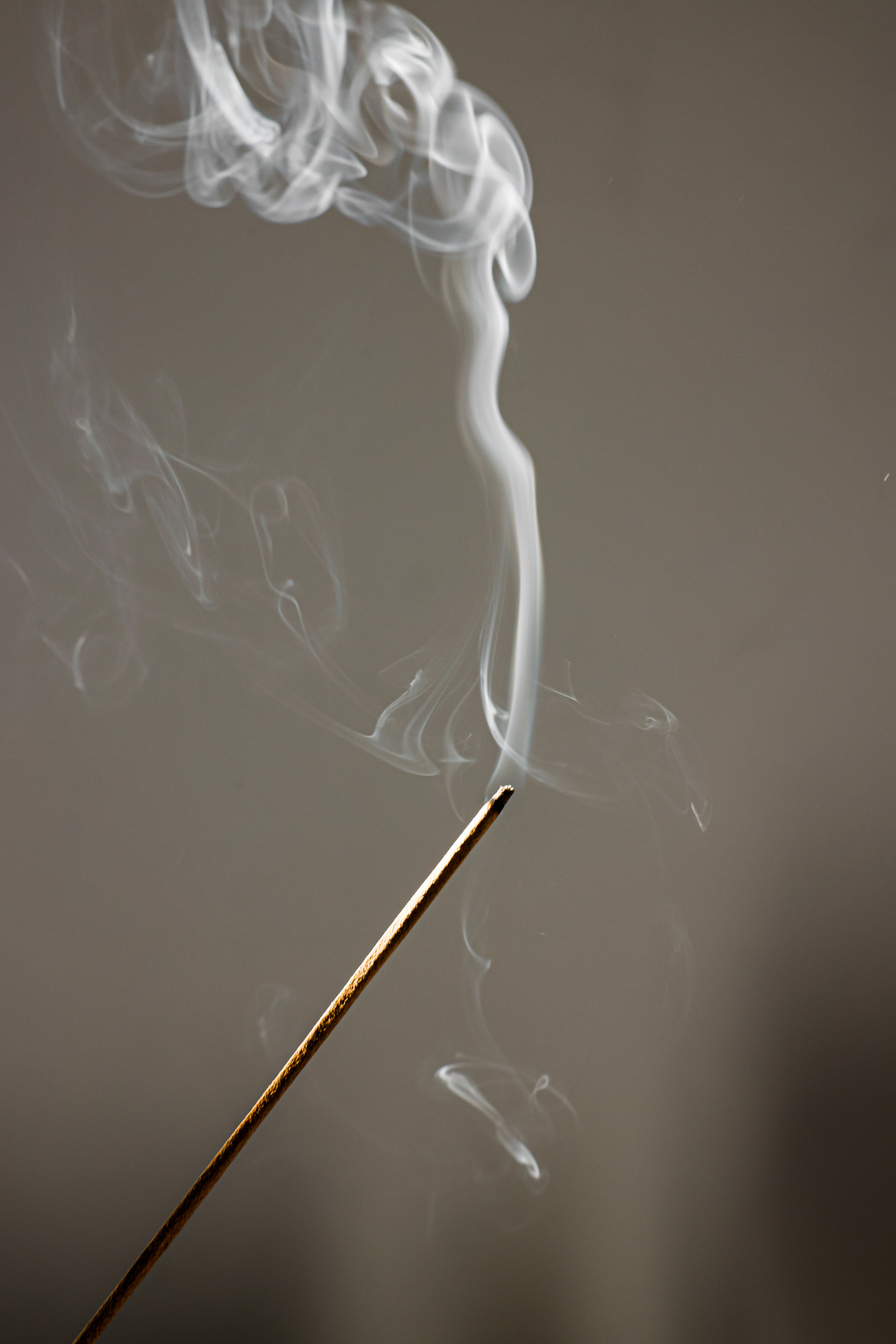 Selective Focus Photo of an Incense with Smoke